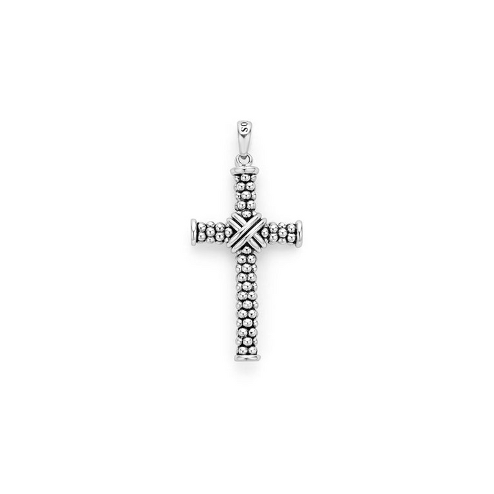 A close-up of a white gold cross amulet in the middle of a white background. The amulet features an x motif in the middle of the cross and caviar beading.