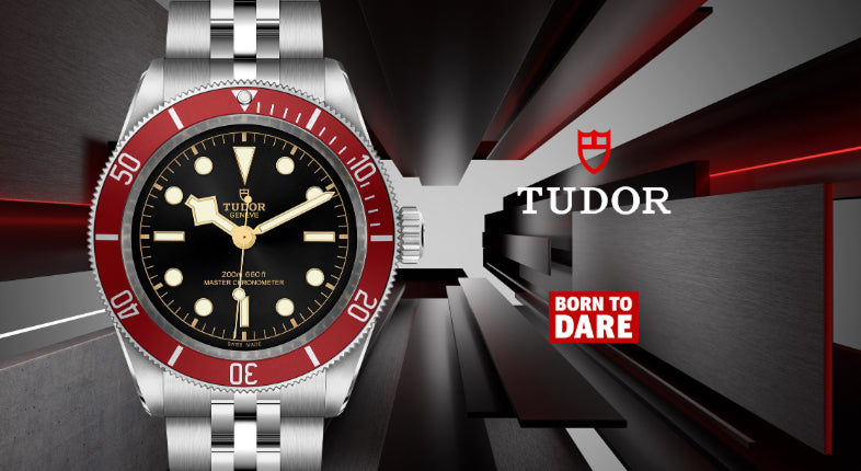 A banner photo of a Tudor watch with a black dial and red bezel on the left against a dark background featuring the Tudor logo and 'Born to Dare' text on the right. A banner photo of a Tudor watch with a black dial and red bezel on the left against a dark background featuring the Tudor logo and 'Born to Dare' text on the right.