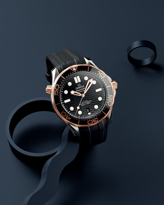 An OMEGA Seamaster watch is displayed in the middle of a navy background. The watch features a black dial, bezel, stainless steel case, and rubber strap.