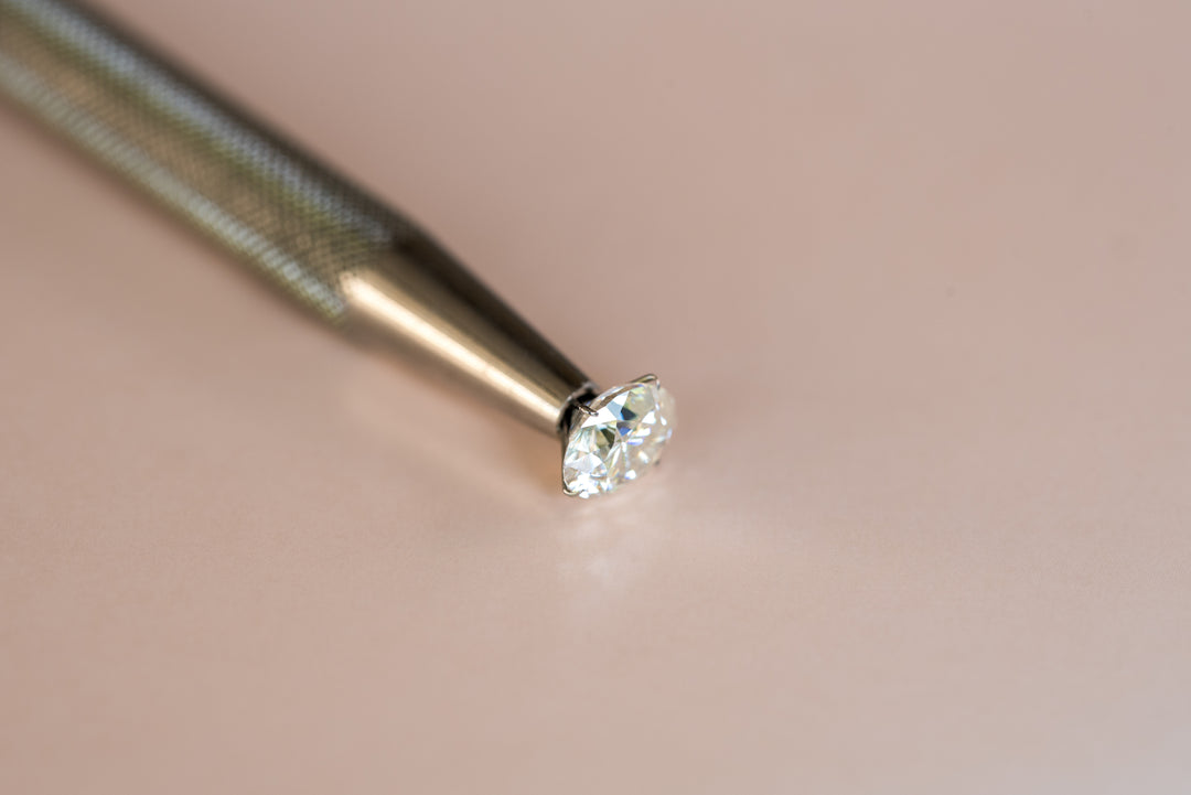 photo of a loose diamond sitting on a metal stick