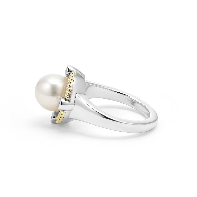 A side-view of a sterling silver and 18k gold ring displayed in the middle of a white background featuring a freshwater cultured pearl surrounded by sterling silver, diamonds, and 18K gold