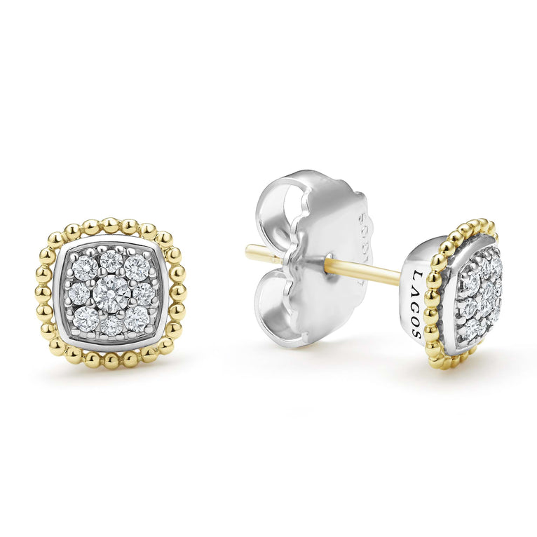 A pair of two-toned stud earrings surrounded by 18K gold Caviar beading and smooth sterling silver. The right earring is angled to the side, showing the back.