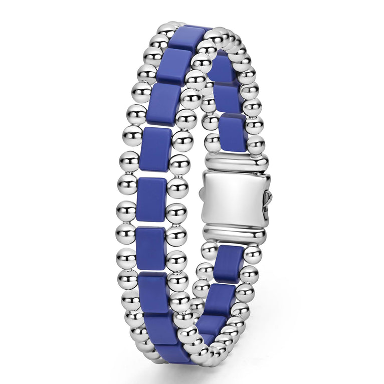 A back-view of a stainless steel bracelet in the middle of a white background featuring matte ultramarine ceramic and caviar beading.