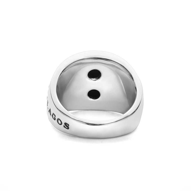 A back-view of a sterling silver ring in the middle of a white background featuring a black agate gemstone and sterling silver Caviar beading