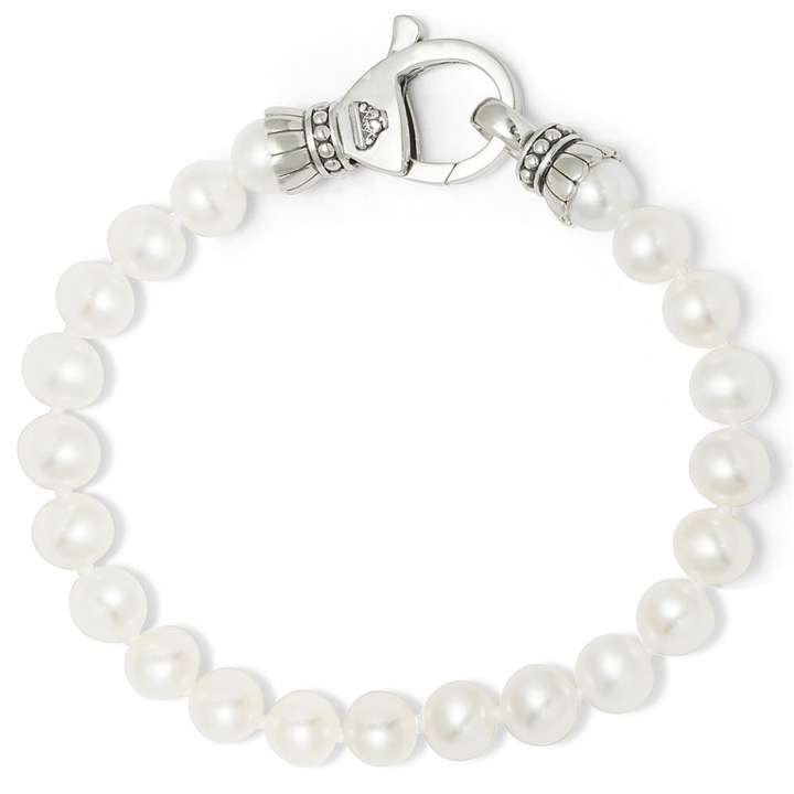 A bracelet in the middle of a white background featuring a single strand of cultured freshwater pearls