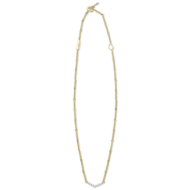 A18k gold necklace featuring caviar beading and a white gold chevron design against a white background and showing the clasp at the top against a white background.