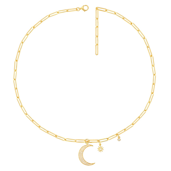 A close-up of a yellow-gold Moon and Stars Paperclip Chain against a white background. The necklace features a moon-shaped pendant, 2 round diamonds, and a yellow-gold paperclip chain.