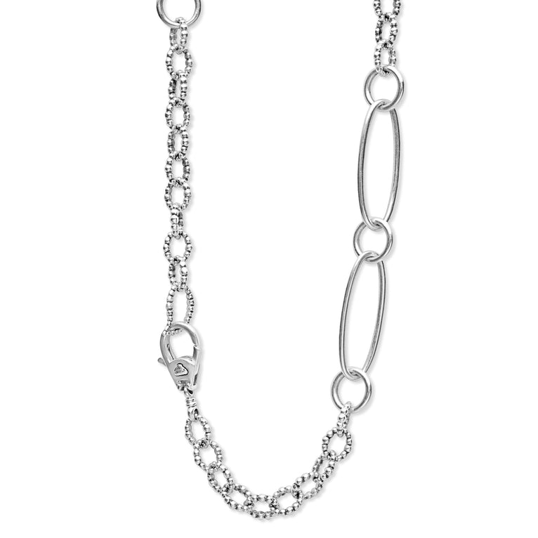 A close-up of a sterling silver necklace highlighting the clasp.