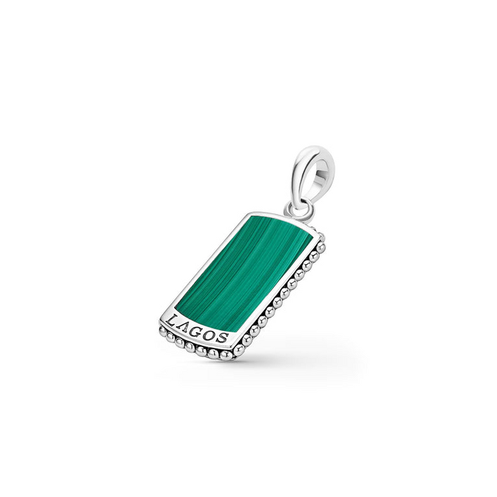 A Malachite Tag Amulet displayed in the middle of a white background with a Malachite gemstone