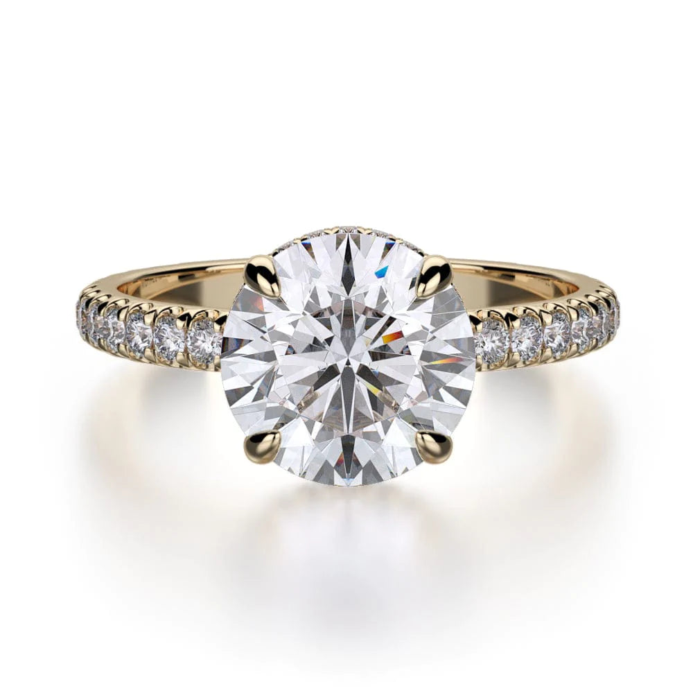 The Hidden Halo Pave Engagement Ring, made of yellow gold, lies flat against a white background. It features a round-cut diamond set in the center with a diamond set band