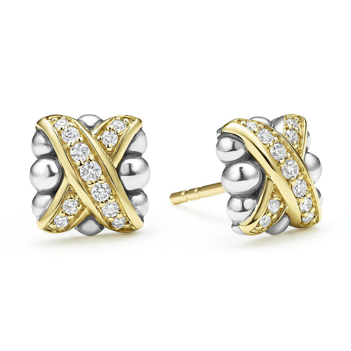 A pair of two-tone stud earrings with 18K gold and diamonds surrounded by sterling silver and an x motif. The right earring is angled to the side.