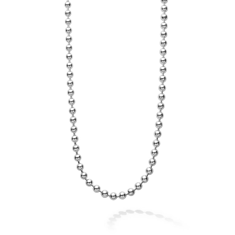 A close-up view of a sterling silver necklace featuring a ball chain.