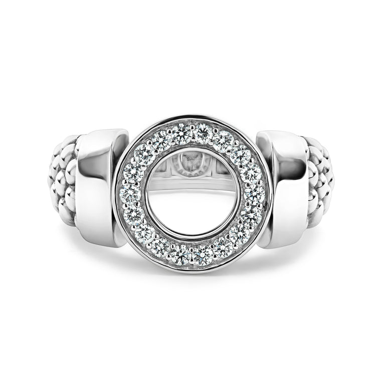 A sterling silver ring in the middle of a white background featuring a diamond circle design and caviar beading.