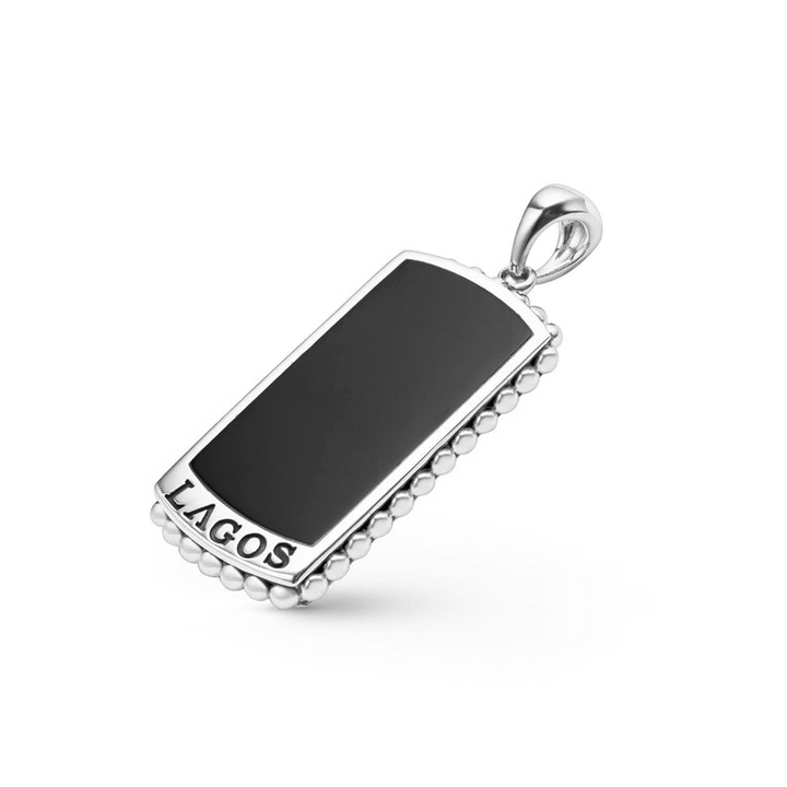 A tag amulet angled in the middle of a white background featuring Black agate accented by sterling silver Caviar beading