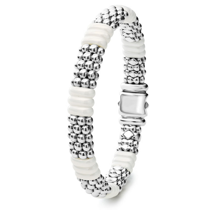 A side-view of a sterling silver beaded bracelet in the middle of a white background, featuring Sterling silver Caviar beading and smooth white ceramic