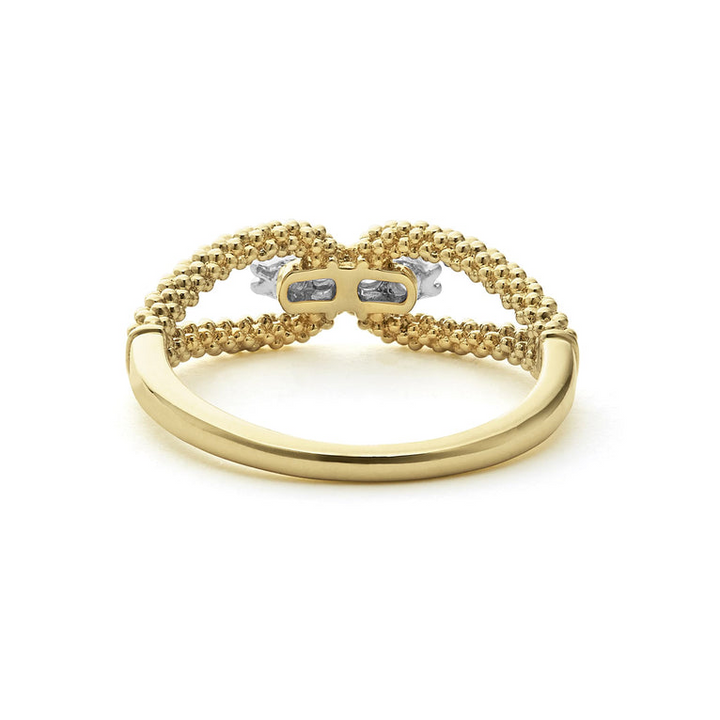 A back-view of An 18K Gold ring in the middle of a white background featuring caviar beading and round diamonds set in the center.