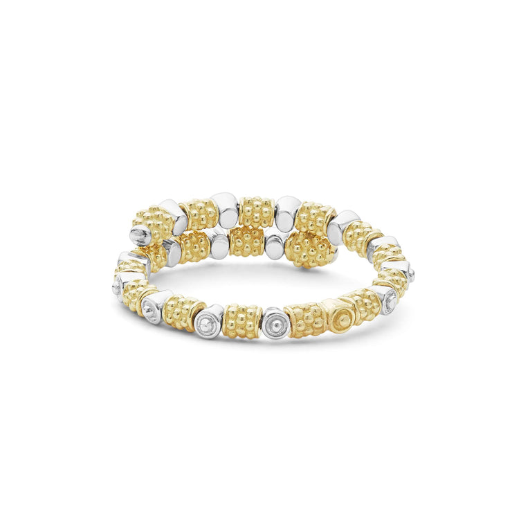 A back view of a yellow gold ring against a white background. The ring features 18k gold superfine Caviar beading, wrap design, and round diamond stations.