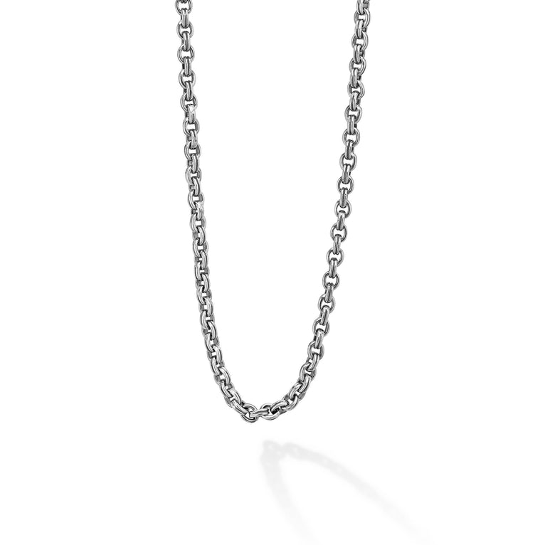 A close-up view of a sterling silver chain featuring Sterling silver fluted links and double link Caviar chain