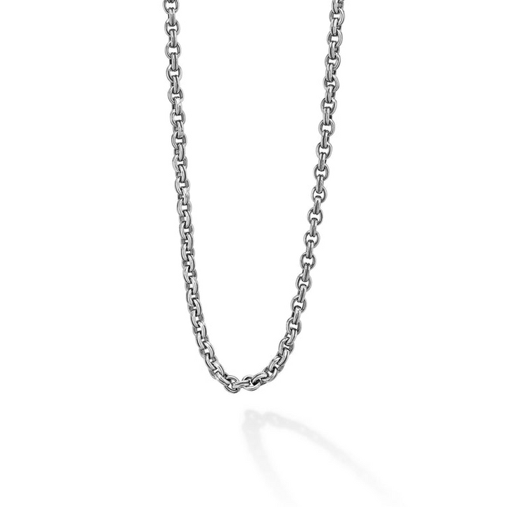 A close-up view of a sterling silver chain featuring Sterling silver fluted links and double link Caviar chain