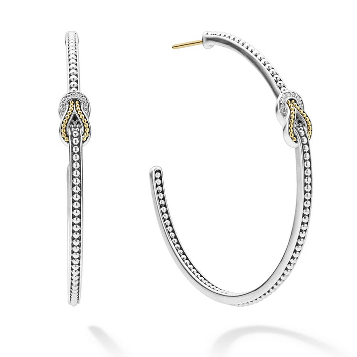 A pair of hoop earrings with diamonds and 18K gold woven in a knot motif. The right earring is angled to the side.