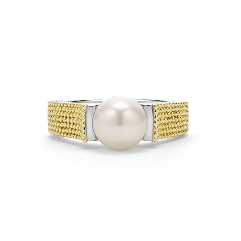 A side-view of a sterling silver and 18k gold ring displayed in the middle of a white background featuring a cultured freshwater pearl and caviar beading. 