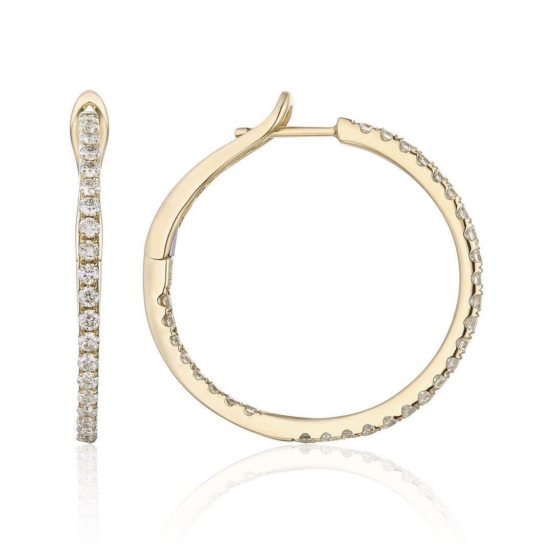 A pair of yellow-gold hoop earrings with a single row of round diamonds. The right earring is angled to the side.