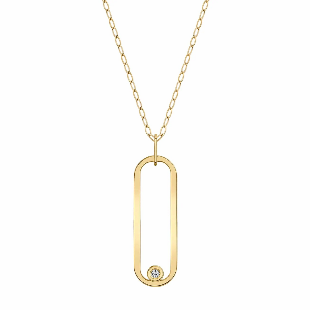 A yellow-gold necklace lying flat against a white background features a flat gold link with a bezel-set diamond.