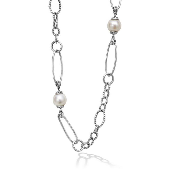 Close-up of a sterling silver necklace featuring five cultured freshwater pearl stations and Caviar beading displayed on a white background.