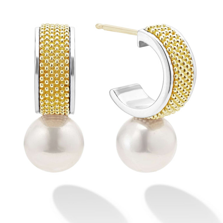 A pair of hoop earrings with 18K gold and sterling silver Caviar beading with pearl drop detailing. The right earring is angled to the side, showing the back. 