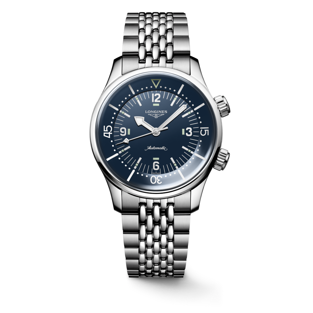 A Longines watch standing straight against a transparent background. The watch features a blue dial, silver & white hands and markers, stainless steel bezel, two crowns, and stainless steel bracelet.