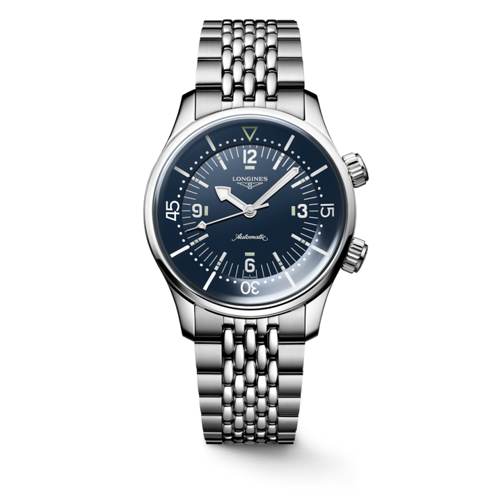 A Longines watch standing straight against a transparent background. The watch features a blue dial, silver & white hands and markers, stainless steel bezel, two crowns, and stainless steel bracelet.