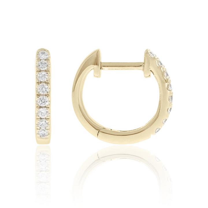 A pair of U-shaped huggies with a single row of round diamonds. The right earring is angled to the side.