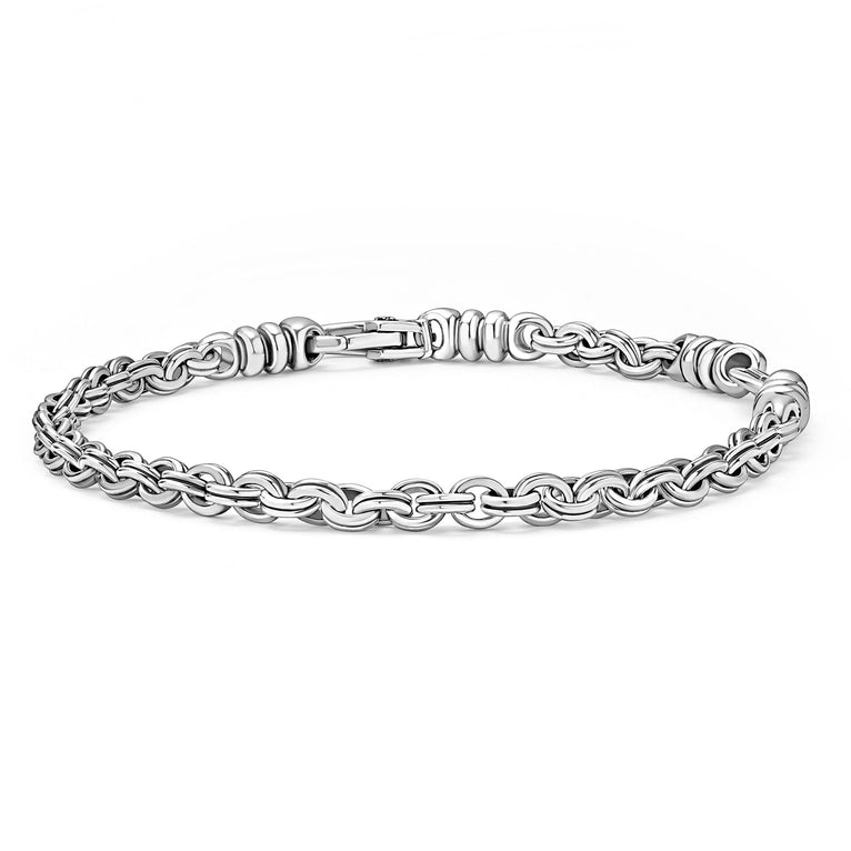 A sterling silver link bracelet angled in the middle of a white background featuring Sterling silver fluted links