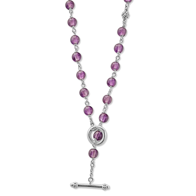 A sterling silver and ceramic beaded necklace in the middle of a white background featuring Amethyst ceramic and silver caviar beading highlights the lobster clasp.