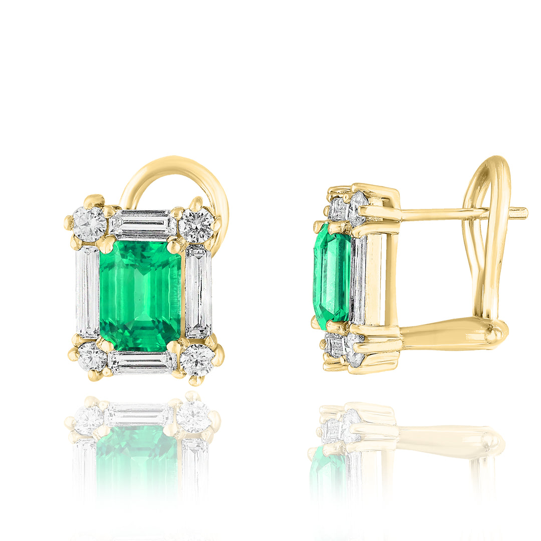 A pair of stud earrings displayed in the middle of a white background, the right earring angled to the side. The earring features an emerald center stone with surrounding 4 round and rectangular diamonds.