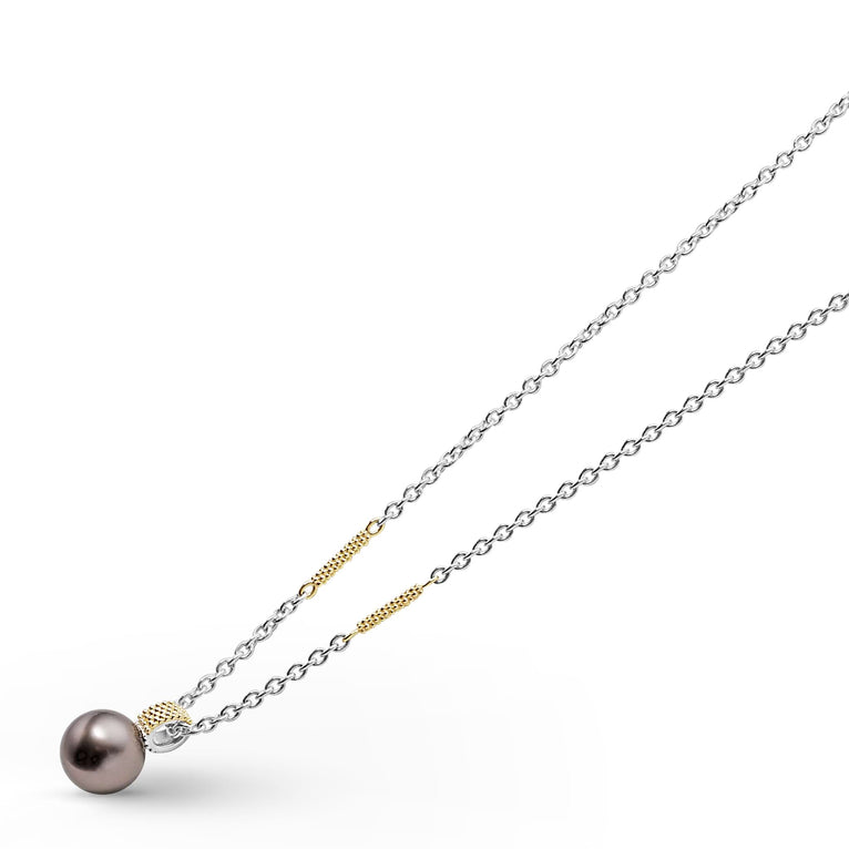 A close-up of a sterling silver & 18k gold necklace angled to the right, featuring a tahitian black pearl against a white background.