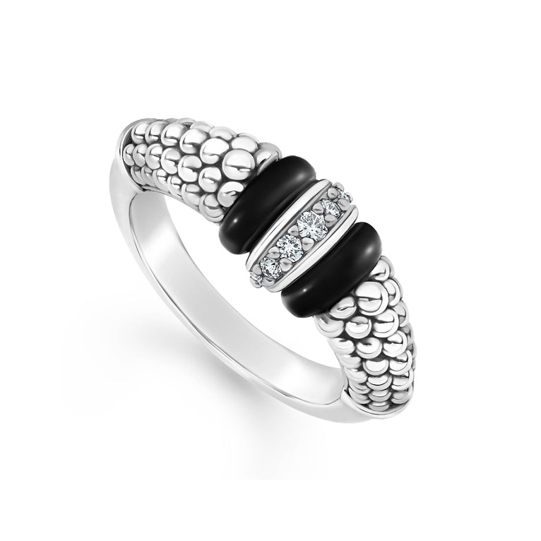 A sterling silver ring is displayed angled on a white background featuring black ceramic caviar beading with a row of diamonds.