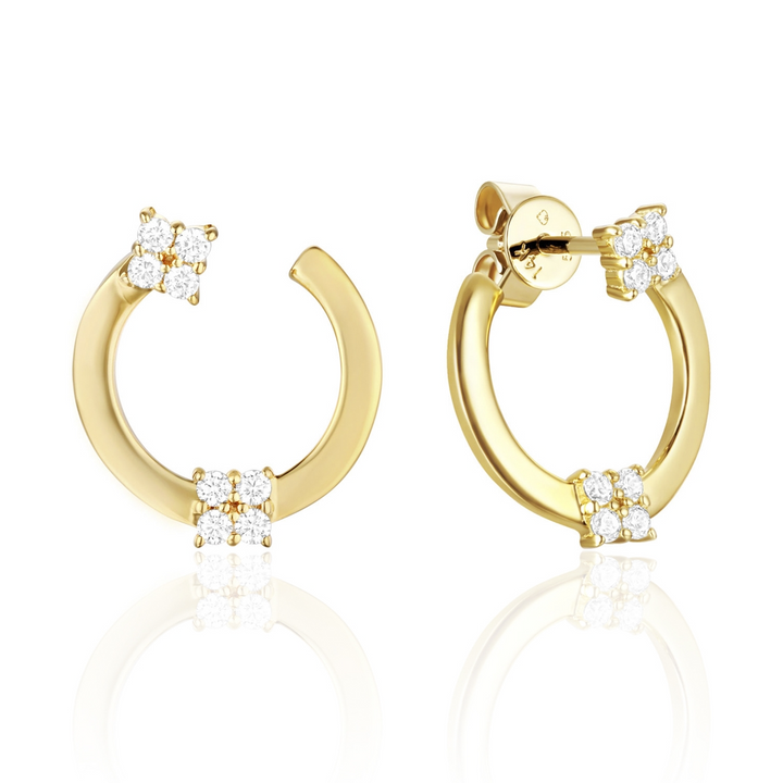 A pair of stud earrings with an open circle with floral diamond motifs. The right earring is angled to the side, showing the back.