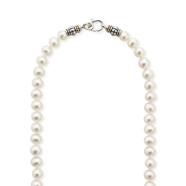 A close-up of a pearl necklace highlighting the clasp.