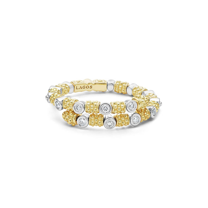 An 18K Gold ring in the middle of a white background featuring diamonds surrounded by 18k gold superfine Caviar beading in a wrap design.