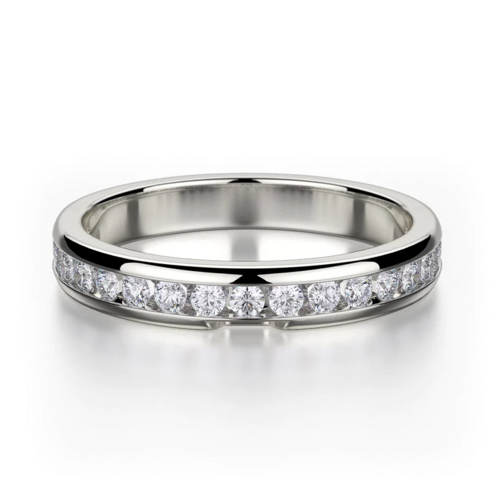 A white-gold ring lies flat against a white background. It features a bezel set of round diamonds.