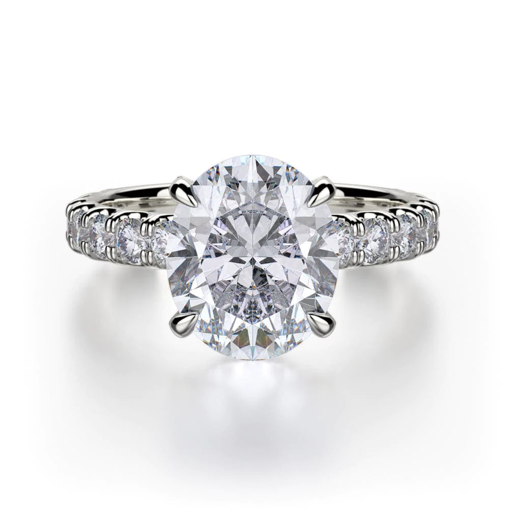 The 3/4 Eternity Engagement Ring, made of white gold, lies flat against a white background. It features a large oval-cut diamond set in the center and a round diamond-set band in a pave setting. 