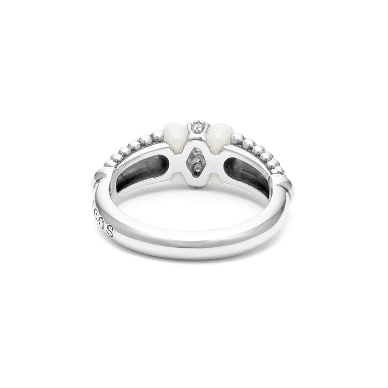 A back-view of a sterling silver ring is displayed on a white background featuring white ceramic caviar beading with a row of diamonds.