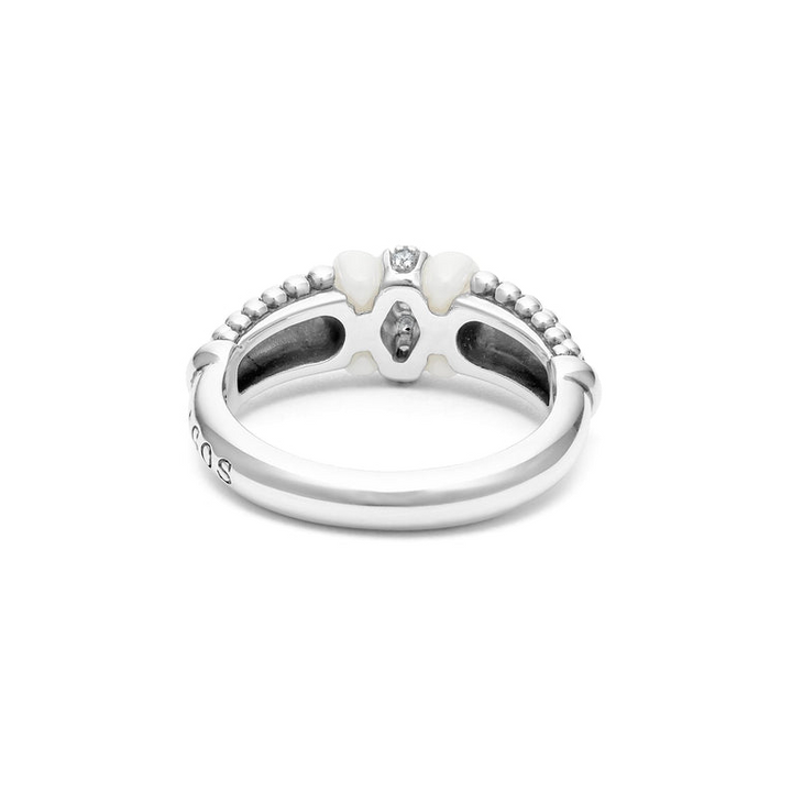 A back-view of a sterling silver ring is displayed on a white background featuring white ceramic caviar beading with a row of diamonds.