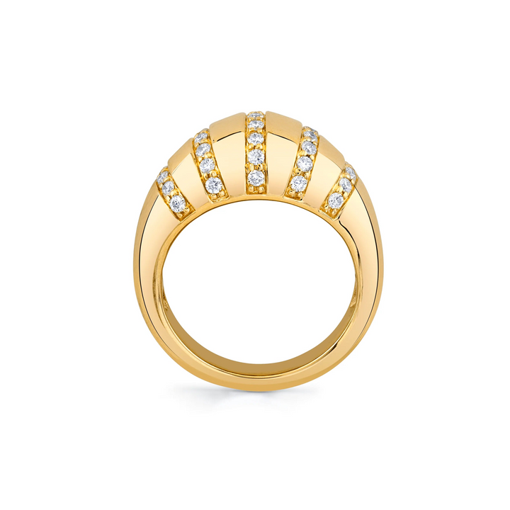 A side view of a yellow-gold ring. The ring features five rows of round paved set diamonds on a domed-shaped signet ring.