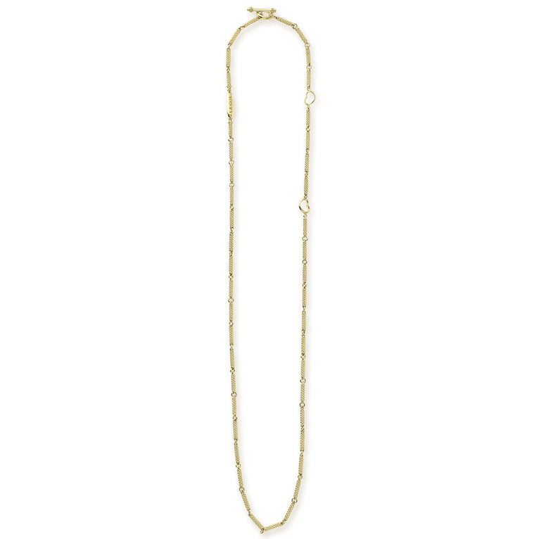 A18k gold necklace featuring caviar beading and a toggle clasp against a white background and showing the clasp at the top against a white background.