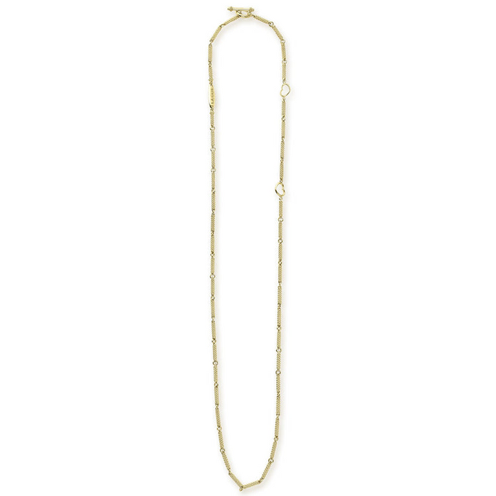 A18k gold necklace featuring caviar beading and a toggle clasp against a white background and showing the clasp at the top against a white background.