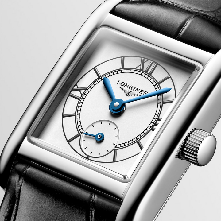 This is a close-up of a Longies watch angled to the right, showcasing the dial with a white background. The rectangular-shaped watch features a white dial, blue hands, black markers, a stainless steel bezel, and a black leather strap.