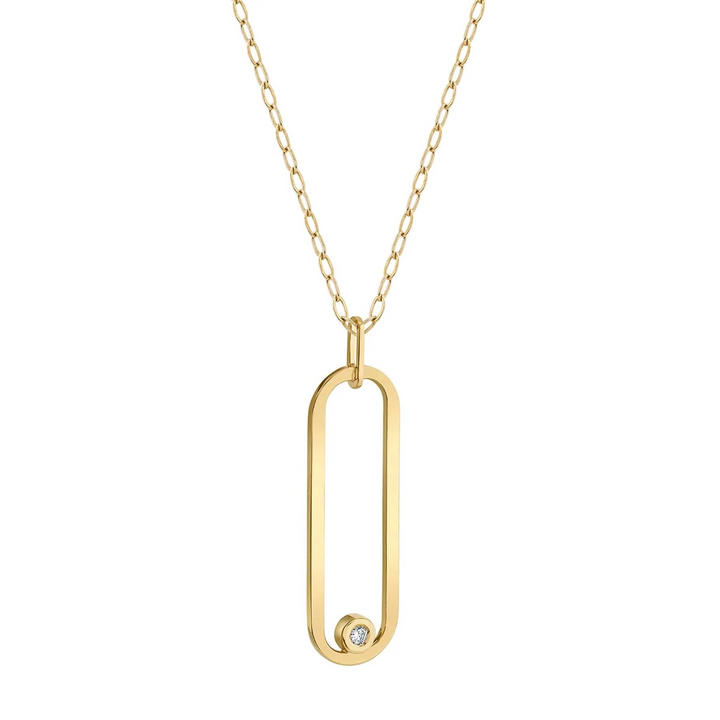 A yellow-gold necklace lying flat and angled to the left against a white background features a flat gold link with a bezel-set diamond.