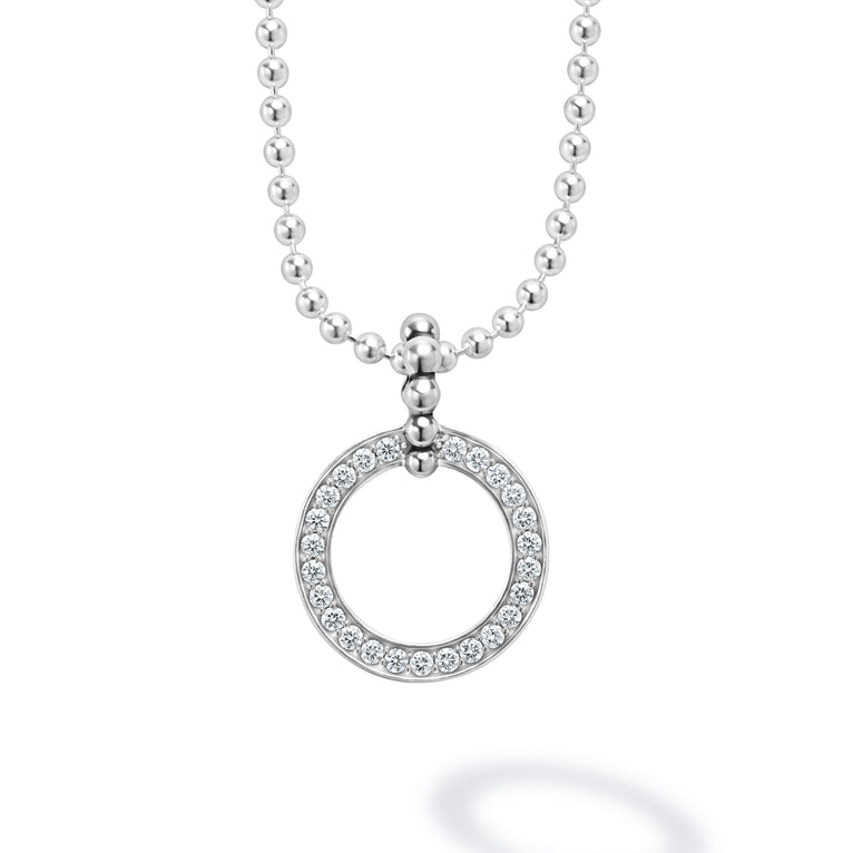 This is a close-up of a sterling silver necklace featuring a diamond circle pendant against a white background.